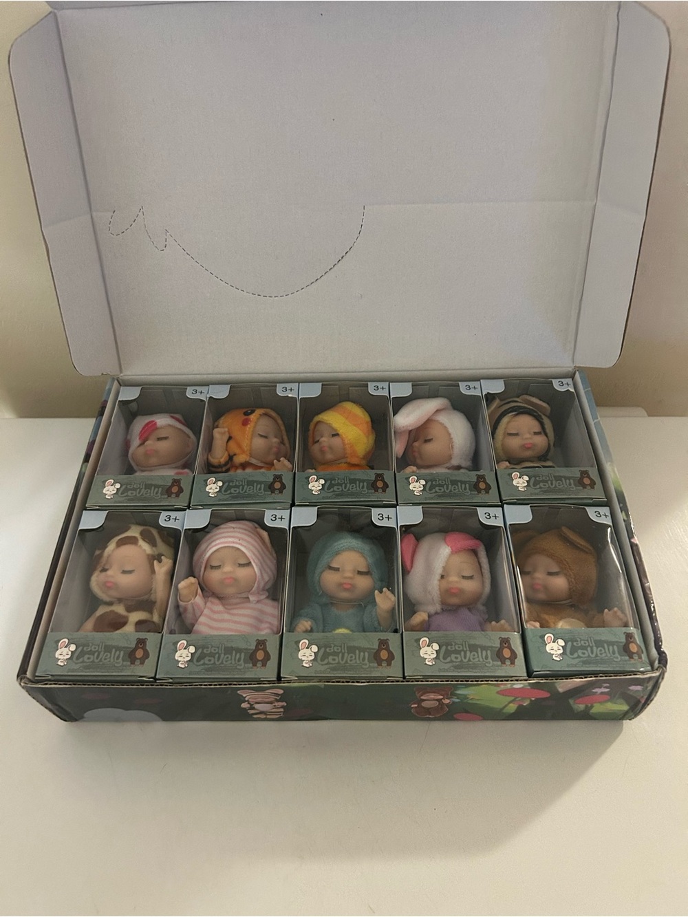 Doll Lovely Baby Dolls Lot of 10 Baby Animal Costume Mini Figures New in Box